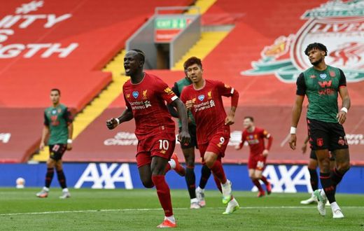 Sadio Mane (centre) celebrates his 20th goal of the season for Liverpool