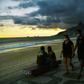 People wear face masks as they walk along Ipanema Beach in Rio de Janeiro on May 19, 2020. The peak of Brazil's outbreak is not expected until June
