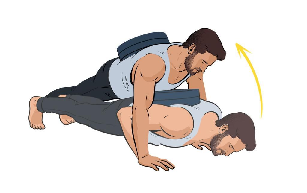 Man doing a plate pushup dropset.