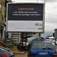 A sign in Abidjan reads 'Coronavirus - I check my sources before sharing news' to warn people against fake news and misinformation about the virus