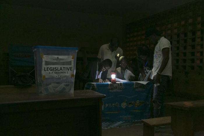 Electoral officials count votes after the February 2020 general and municipal elections in Yaounde, Cameroon