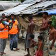 A volunteer urges residents to evacuate to shelters on May 19 ahead of the expected landfall of Super Cyclone Amphan in Khulna, Bangladesh