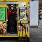 Italians rely on delicacy stores like Gina's at the Porta Palazzo food market in Turin for comfort through the coronavirus emergency