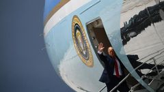 President Donald Trump waves from Air Force One in Miami on July 10, 2020