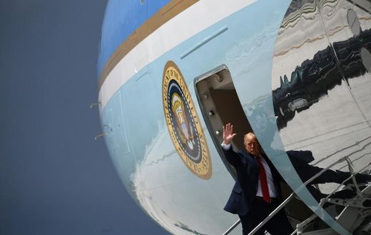 President Donald Trump waves from Air Force One in Miami on July 10, 2020