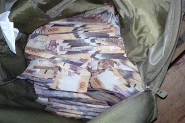 File image of money in a bag confiscated by police as evidence