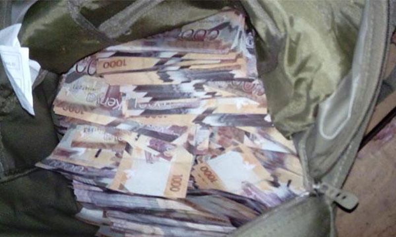 File image of money in a bag confiscated by police as evidence