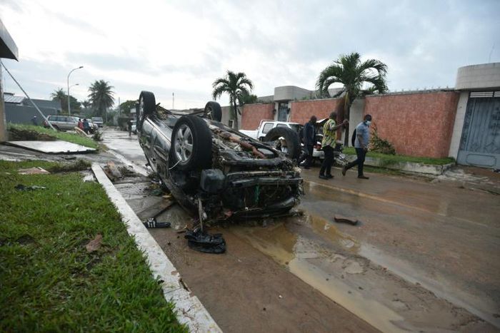 The floods in Ivory Coast's economic capital Abidjan flipped cars and destroyed houses, then were gone as quickly as they came