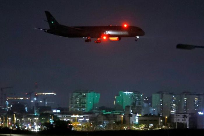 A cargo plane operated by Etihad Airways carrying medical aid to help Palestinians cope with the coronavirus pandemic  prepares to land at Israel's Ben Gurion Airport near Tel Aviv on June 9, 2020