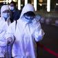 Many passengers wore hazmat suits as they arrived at Wuhan's Wuchang rail station to board some of the first trains to leave the Chinese city in more than two months
