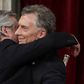 Outgoing president Mauricio Macri embraces his leftist rival and new Argentine President Alberto Fernandez at the inauguration in Buenos Aires on December 10, 2019