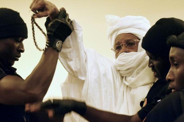 Former Chadian dictator Hissene Habre (C, pictured being escorted to court in 2015) has been granted two months' leave from prison as his jail is being used for new detainees in coronavirus quarantine