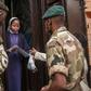 Malagasy army soldiers distribute masks and samples of a local herbal tea, touted by President Andry Rajoelina as a powerful remedy against the COVID-19 coronavirus, in Antananarivo