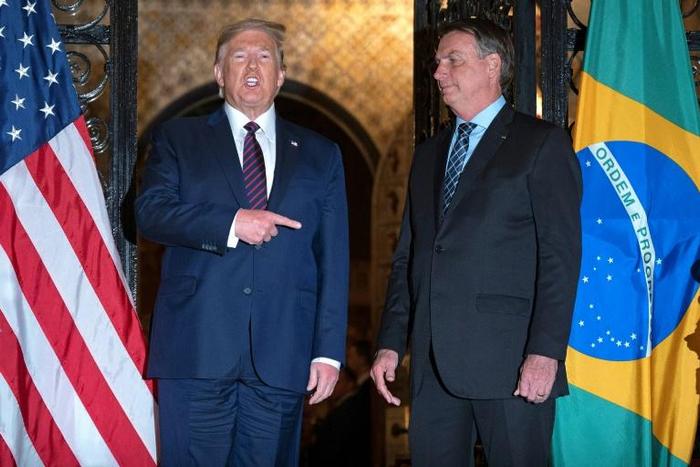 President Donald Trump (L) speaks with Brazilian counterpart Jair Bolsonaro at the US leader's Mar-a-Lago resort in Palm Beach, Florida, on March 7, 2020