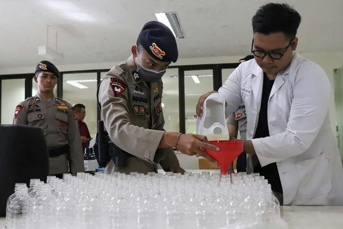 Staff at a Bali university have turned 4,000 litres of local palm wine into a hand sanitiser to protect residents of the holiday island against the coronavirus