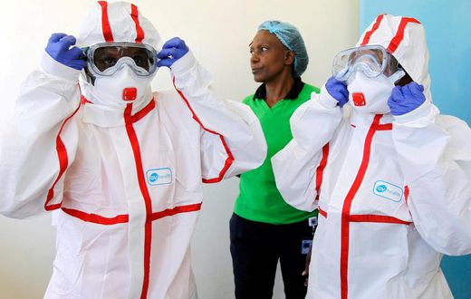 Kenyan medics during a demonstration of preparations for any potential coronavirus cases at the Mbagathi Hospital, isolation centre for the disease, in Nairobi