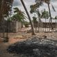 A mound of ashes is seen in the recently attacked village of Aldeia da Paz outside Macomia, Mozambique, on August 24, 2019