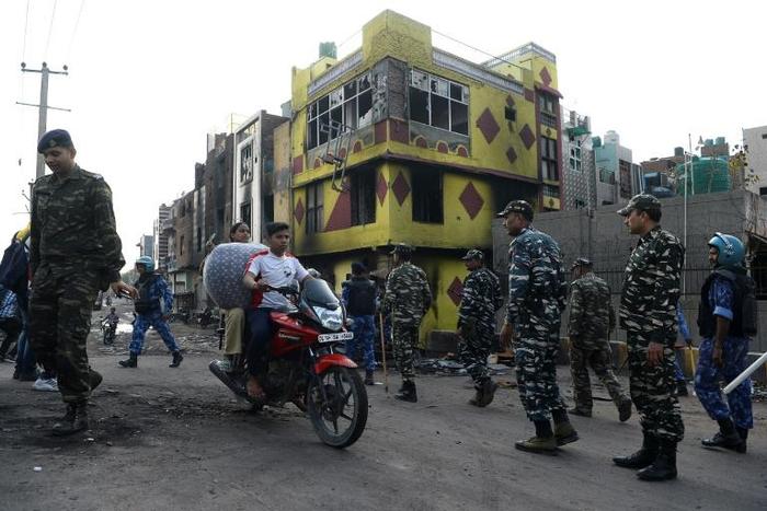Indian police patrol a riot-affected area in New Delhi