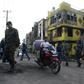 Indian police patrol a riot-affected area in New Delhi