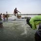 Malian children freshen up in the cool waters of the Niger River before breaking the fast