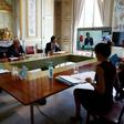 French President Emmanuel Macron (L) attends a videoconference with G7 leaders on coordination of the COVID-19 pandemic response at the Elysee presidential Palace in Paris on April 16, 2020