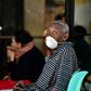An eldely man wears a protective mask to prevent the spread of the coronavirus as he waits for nurses at a hospital in Tegucigalpa, Honduras