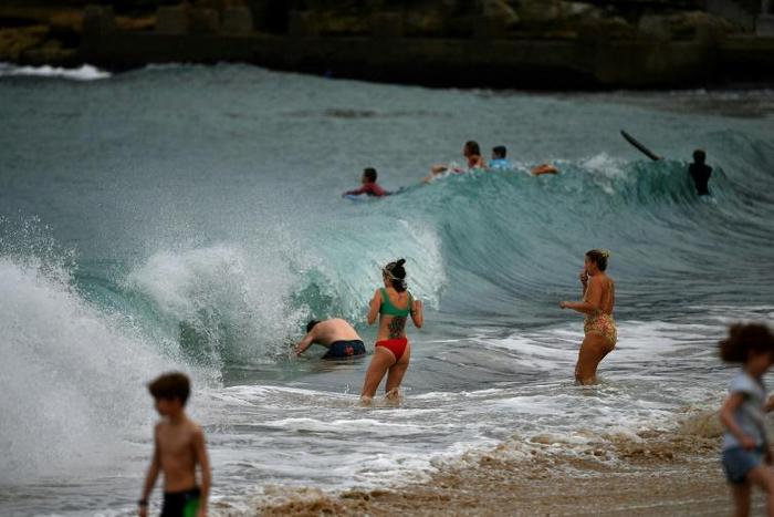Authorities in Sydney have reopened some beaches for walking, running, swimming and surfing
