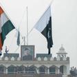 The Indian and Pakistan flags fly during the daily beating of the retreat ceremony at the Wagah Border