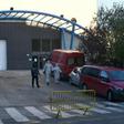 Policemen and undertakers wearing protective suits
stand outside the Palacio de Hielo (Ice Palace) in Madrid s