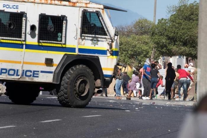 South African police clashed with Cape Town township residents protesting over access to food aid during a coronavirus lockdown