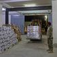 Yemeni men unload medical aid at a hospital warehouse in the war-torn country's second city of Aden, in early May