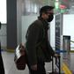 Wall Street Journal reporters Josh Chin (right) and Philip Wen walk through Beijing Capital Airport as they are expelled in February 2020 over a controversial headline in an op-ed in the newspaper