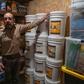 Fortitude Ranch Chief Operating Officer Steve Rene shows a storage room stacked with food in Mathias, West Virginia
