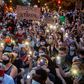 Protestors in Washington hold up their phones at a march on June 3