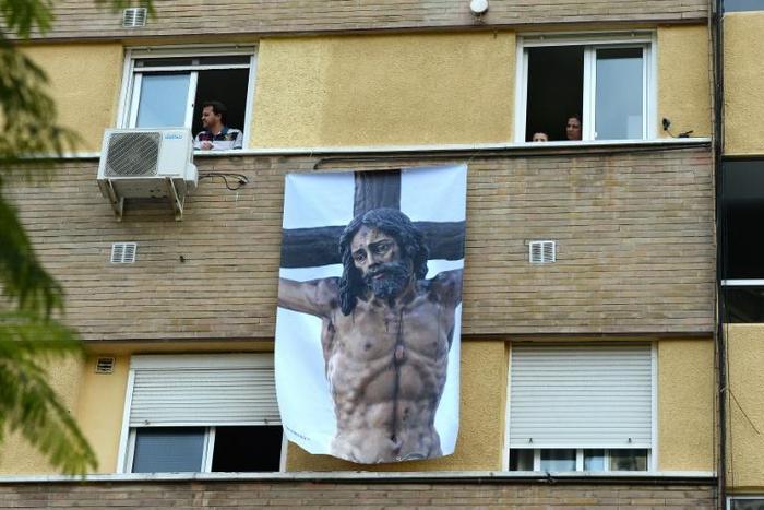 With a nationwide lockdown in place to curb the spread of COVID-19, Spaniards are finding ways to mark Holy Week from their homes