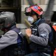 Members of the NGO paramedic group "Angels of the Roads" ride on a motorbike in Caracas, Venezuela