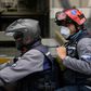 Members of the NGO paramedic group "Angels of the Roads" ride on a motorbike in Caracas, Venezuela