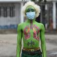 Masked: Performance artist Alex Kalemera tries to raise public awareness about the threat of coronavirus