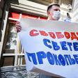 An activist demands 'Freedom for Svetlana' as a Russian court finds journalist Svetlana Prokopyeva guilty of 'justifying terrorism'