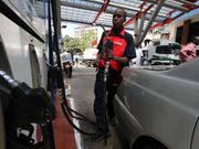A petrol station attendant in Kenya. Fuel prices to drop by upto Sh18 starting midnight today - EPRA announces new prices