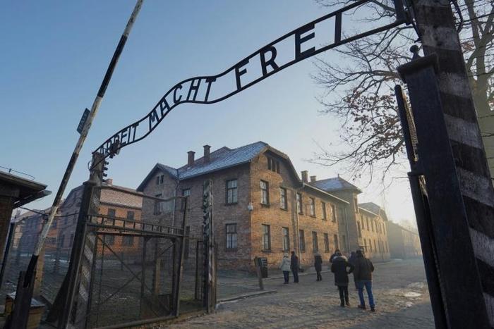 A file picture taken on December 5, 2019 shows the main gate at the entrance to the Nazi Auschwitz concentration and extermination camp in  Poland