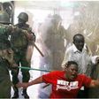 Police whipping Kenyans who were caught up in the night of terror