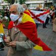 Demonstrators wrapped in Spanish flags protest at what rightwing parties have dubbed a "brutal confinement" after a fifth state of emergency extension