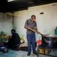 Volunteers from the African Diaspora Forum prepare hot meals for the daily food distribution in Johannesburg