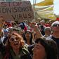 The closure of crossings on the divided island of Cyprus over fears of the spread of coronavirus has sparked angry protests