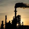 The sun sets behind smoke rising from the LyondellBasell-Houston Refining plant in Houston, Texas, as US crude futures fell below zero for the first time