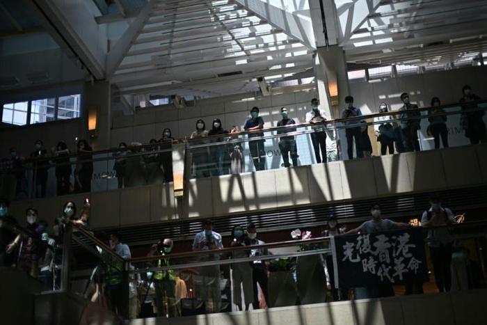 Pro-democracy supporters gather at a shopping mall during a lunchtime rally in Hong Kong on April 29