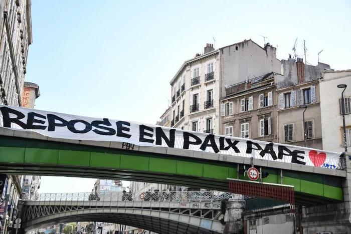 Diouf was the first to die from coronavirus in the country. The banner reads "rest in peace, Pape"