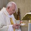 This photo taken and handout on July 8, 2020 by the Vatican Media shows Pope Francis celebrating the Eucharist during a mass at the Santa Marta chapel in The Vatican, marking the 7th anniversary of his visit to Lampedusa on July 8, 2013.