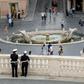 Police keep watch near the Spanish Steps at Piazza di Spagna, in Rome, as the city takes cautious steps to end the virus lockdown